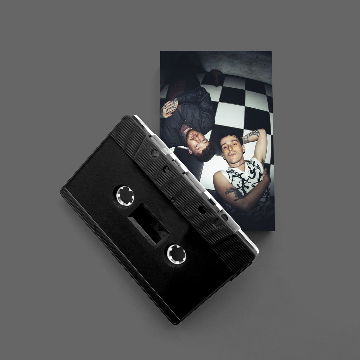 We're Never Getting Out: Dual Black and White Shell Cassette [ vinyl ]